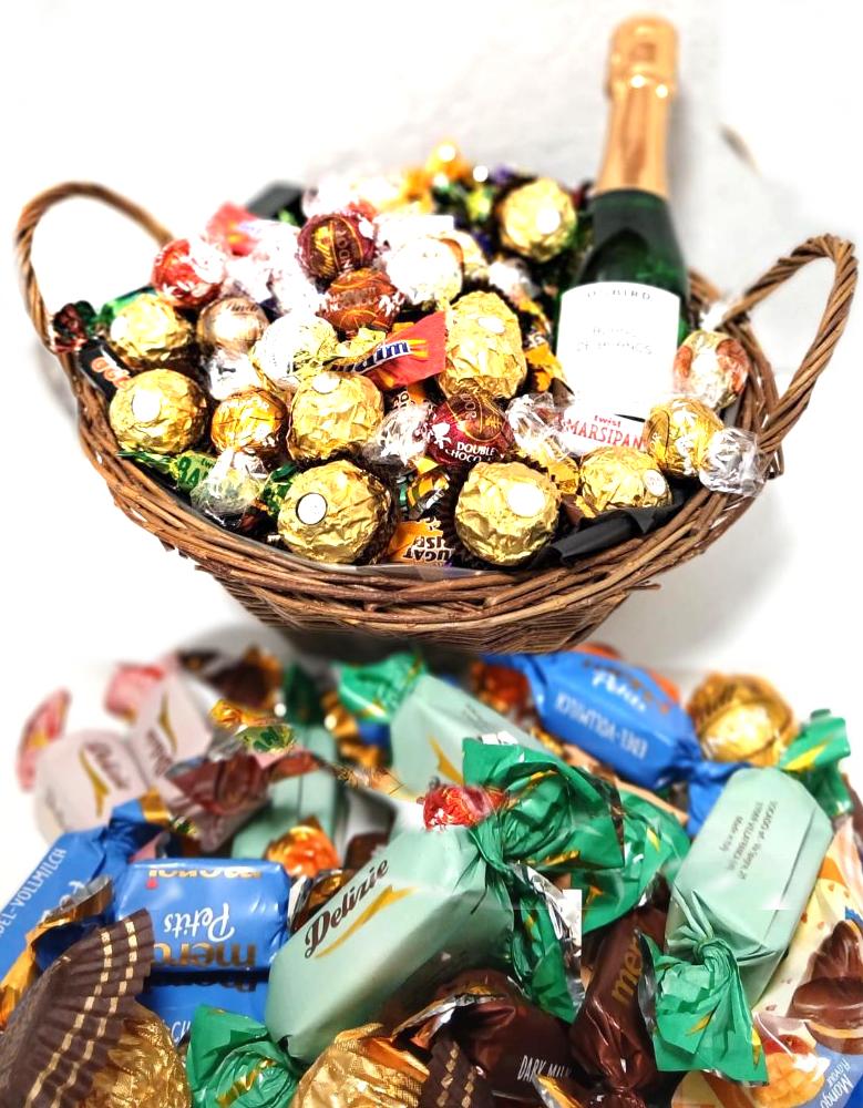 Kurven fylt med Twist, Ferrero Rocher, Lindor, trøfler og Musserende alkoholfri 