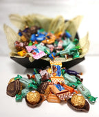 Kurven fylt med Twist, Ferrero Rocher, Lindor, trøfler og alkoholfri 